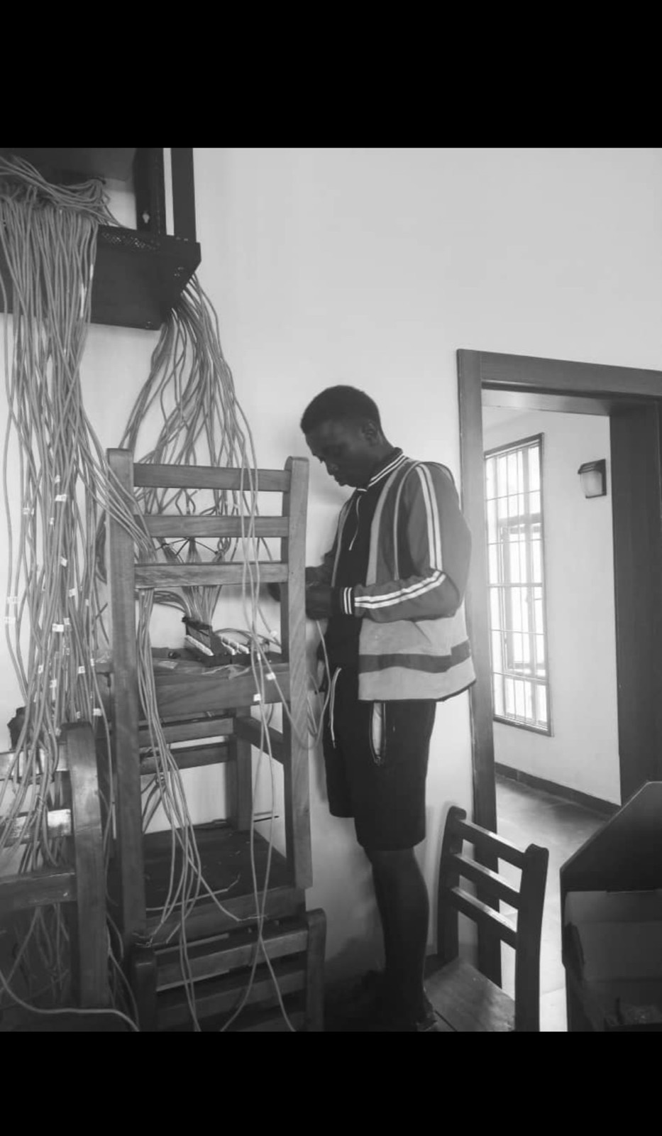 Engineer working on network cabling