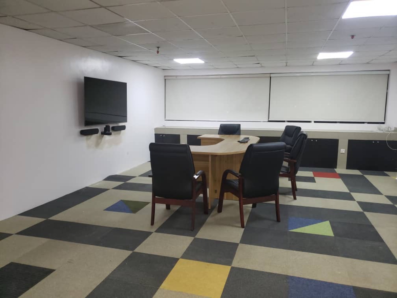 Meeting room with wall display and video bar