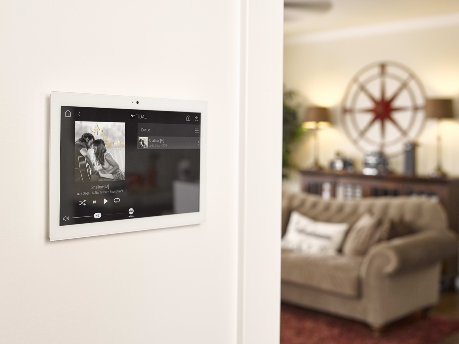 Control4 wall touch panel in a living room
