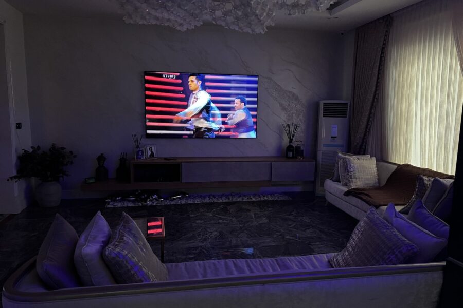 Living room with wall-mounted TV and ambient lighting, Ikoyi apartment