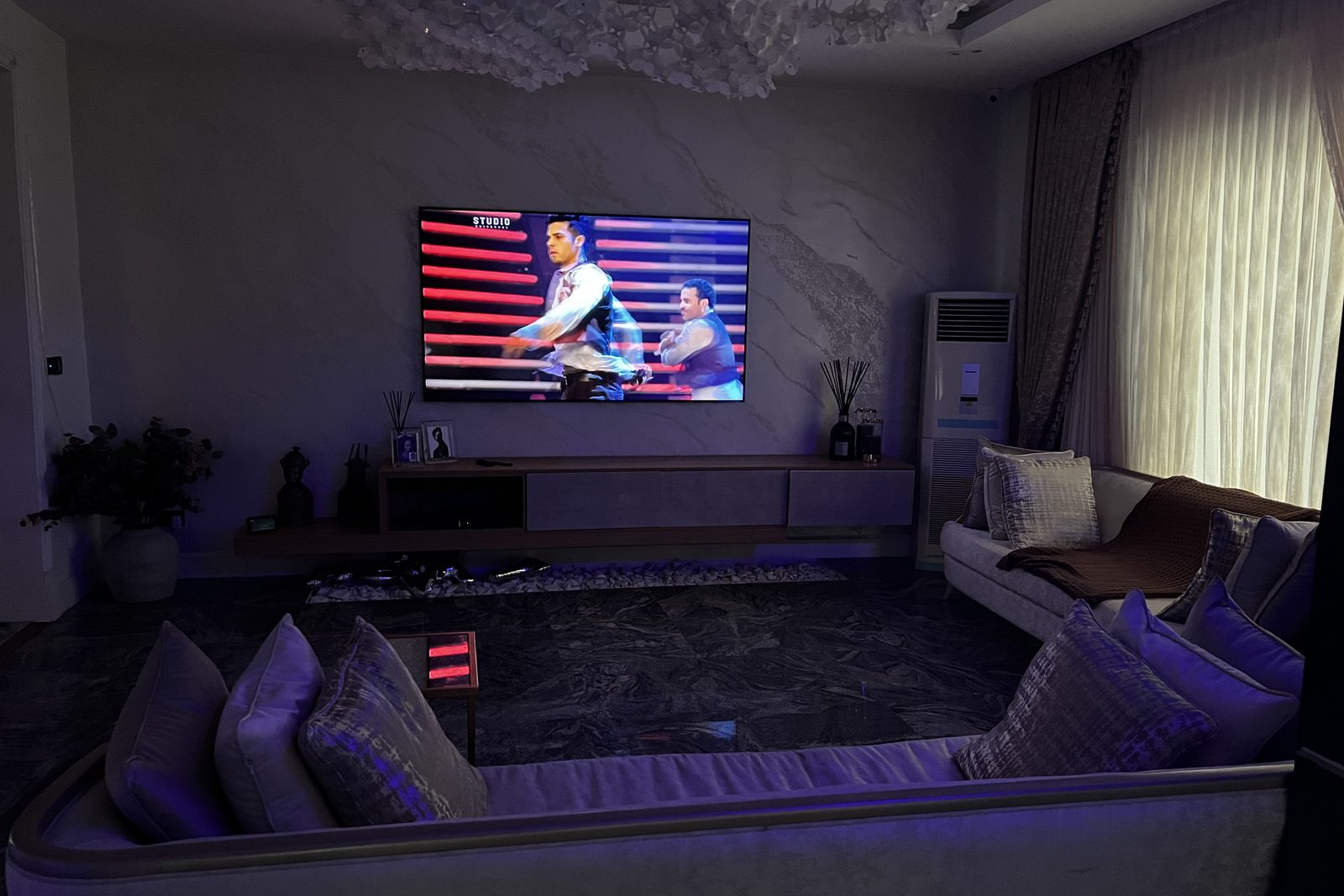 Living room with wall-mounted TV and ambient lighting, Ikoyi apartment