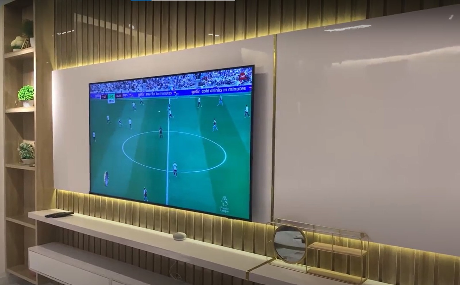 Apartment TV wall with accent lighting